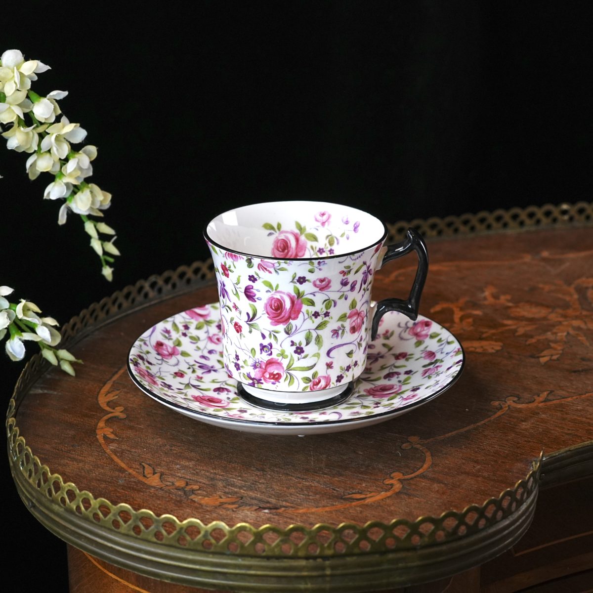Royal Chelsea pink-rose chintz teacup with black handle and rims, pattern 4330 A