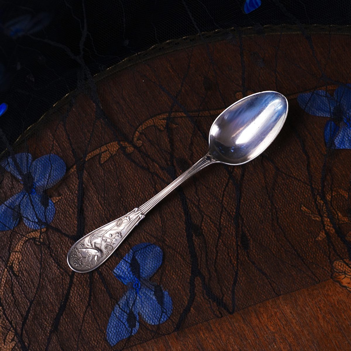 Antique Tiffany sterling silver spoon in the Japanese Audubon pattern with a bird cast on the handle